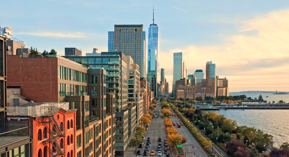 Aerial view of the Lower Manhattan skyline at sunset, viewed from above West Street in Tribeca.