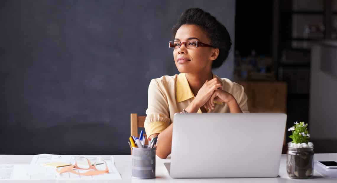 Focused Businesswoman in NYC Office: Contemplating Key Questions for Renting