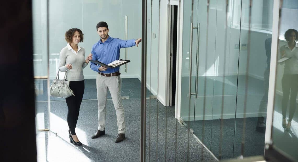 Young businesswoman touring modern NYC office space