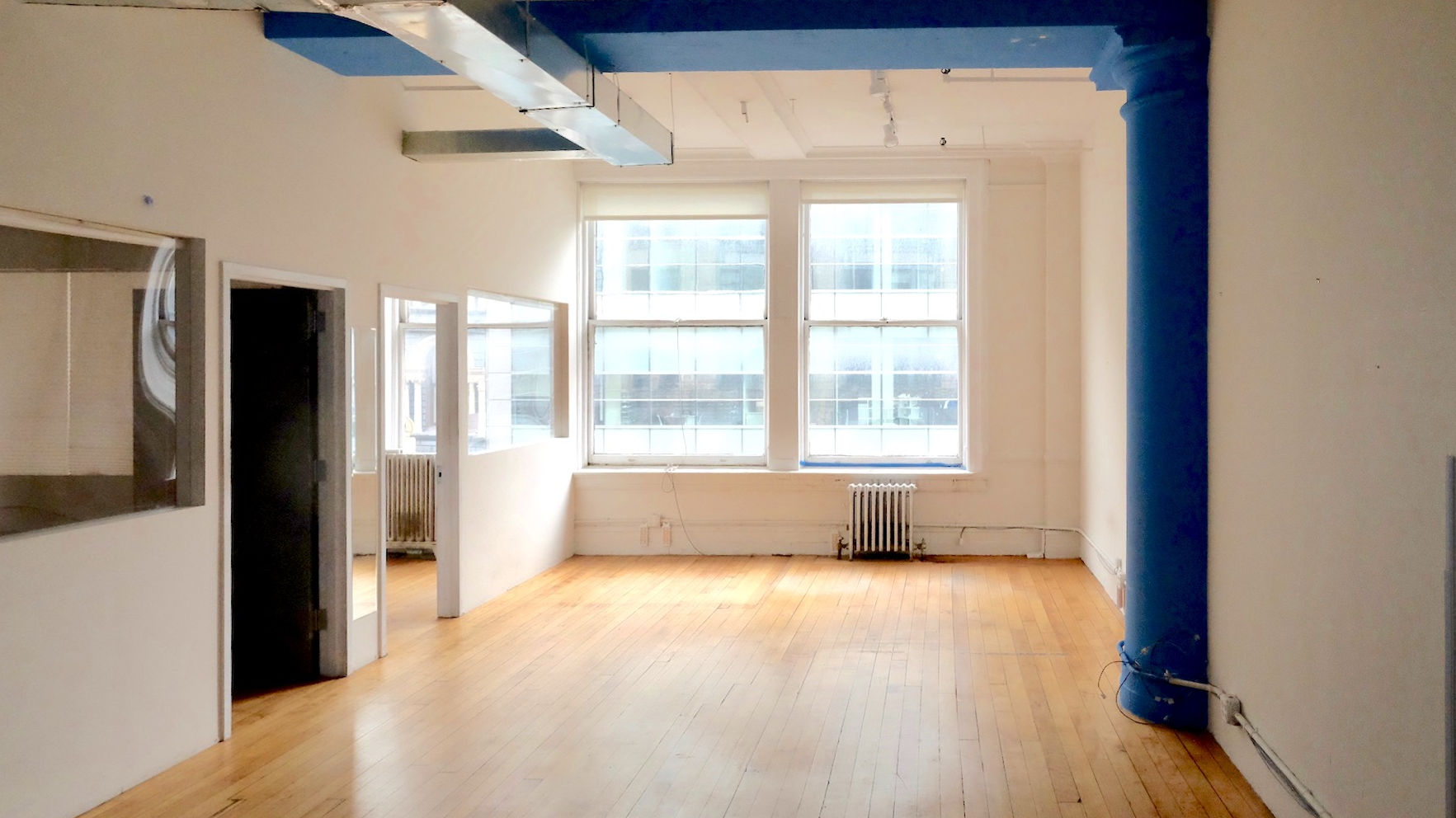 Office Space for Lease in a Landmark Building with oversized windows facing Broadway, NYC.