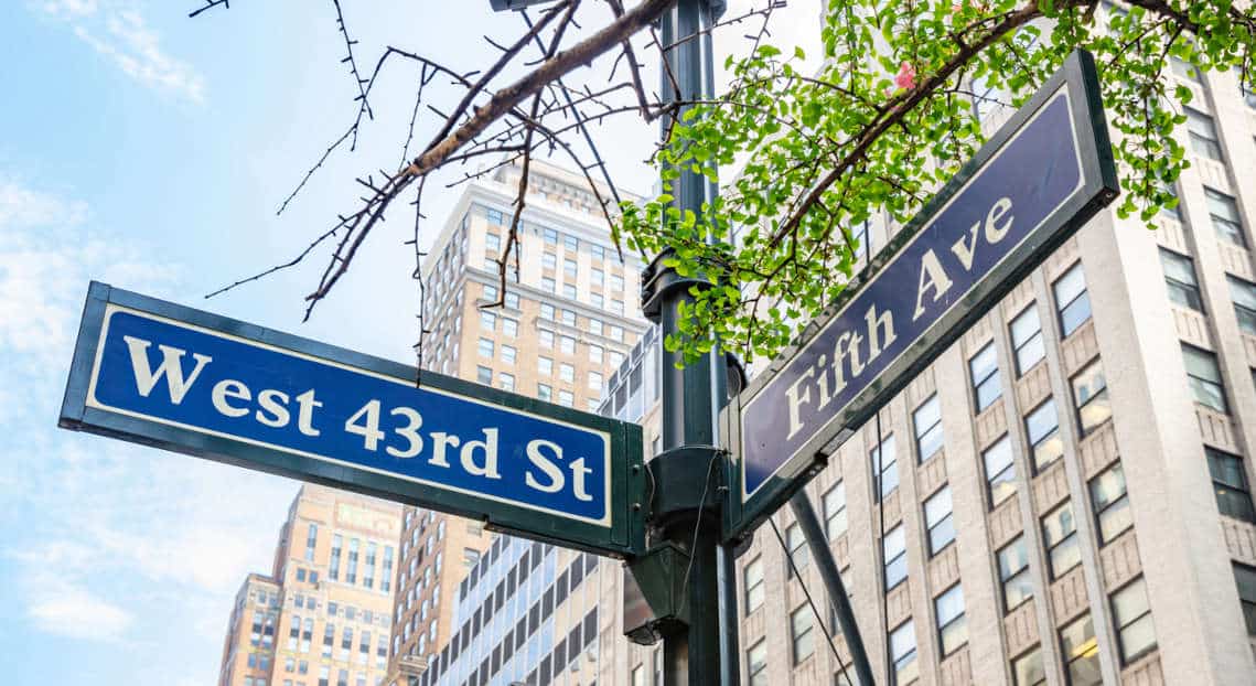 Fifth ave and West 43rd crossroads street signs, Manhattan New York downtown.