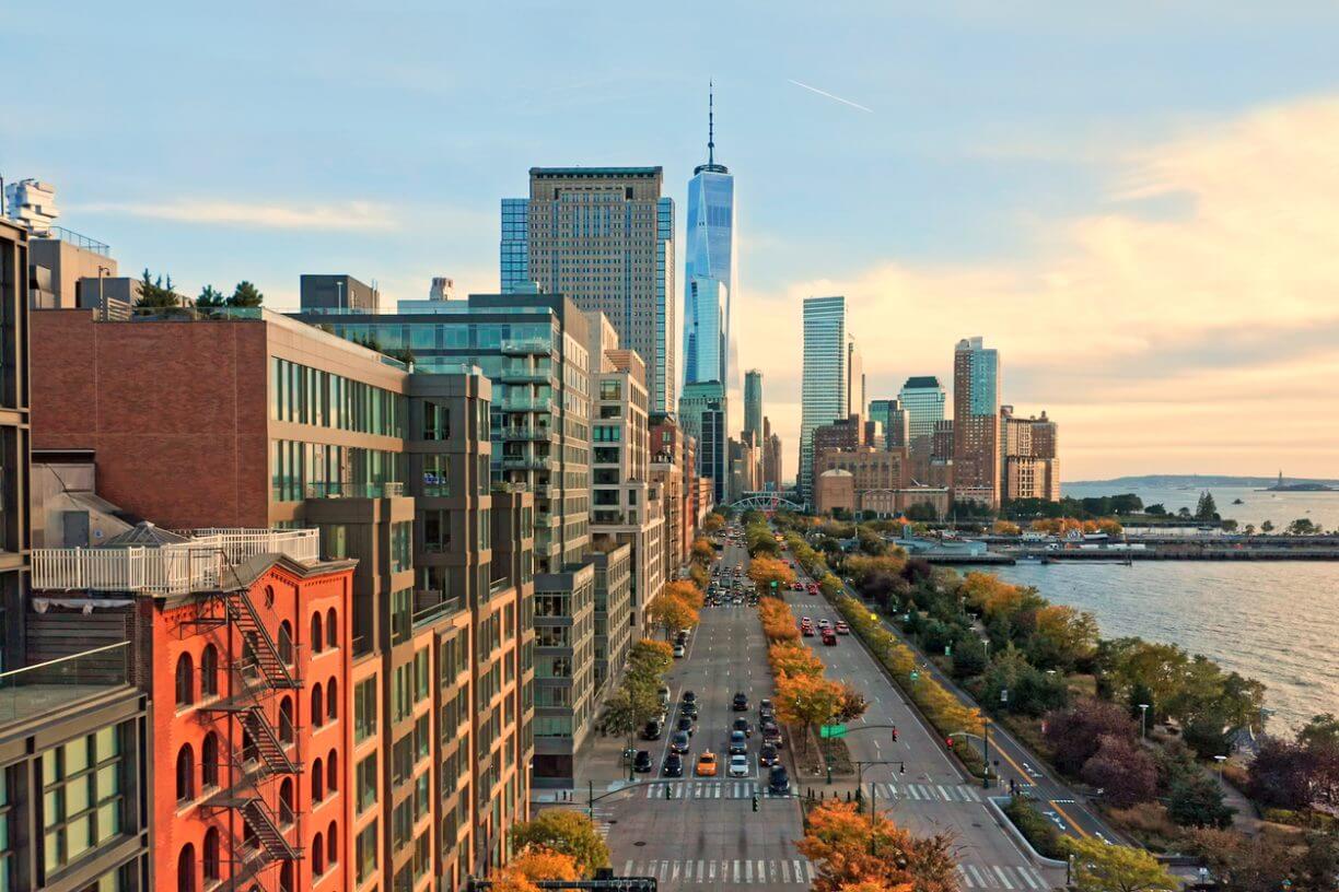 Aerial view of Lower Manhattan skyline at sunset, viewed from above West Street.