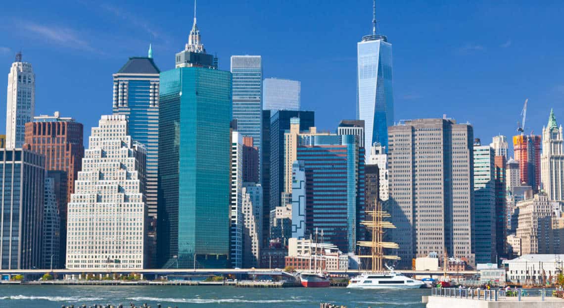 Lower East Side view from Brooklyn Bridge Park with World Trade Center spire.