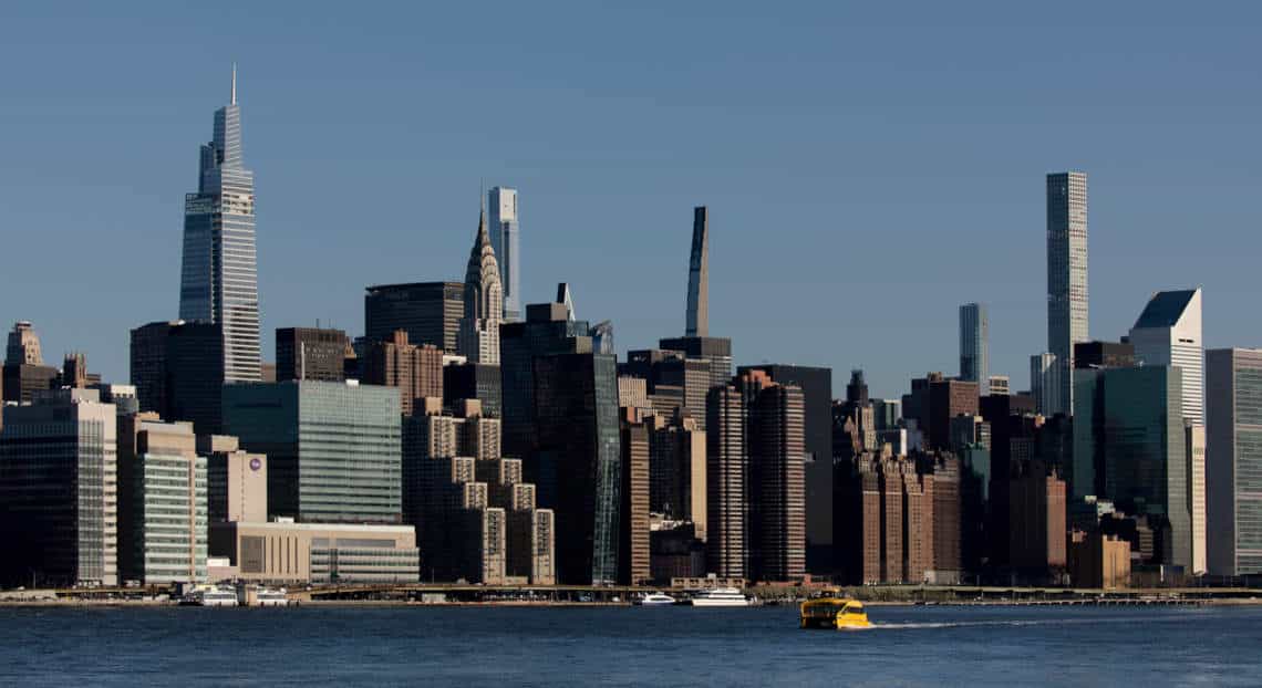 Sentinel Capital HQ move to One Vanderbilt, Midtown Manhattan skyline from East River.