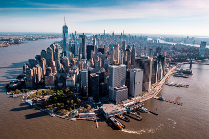 Golden hour aerial view of Downtown Manhattan, a hub of NYC commercial real estate.