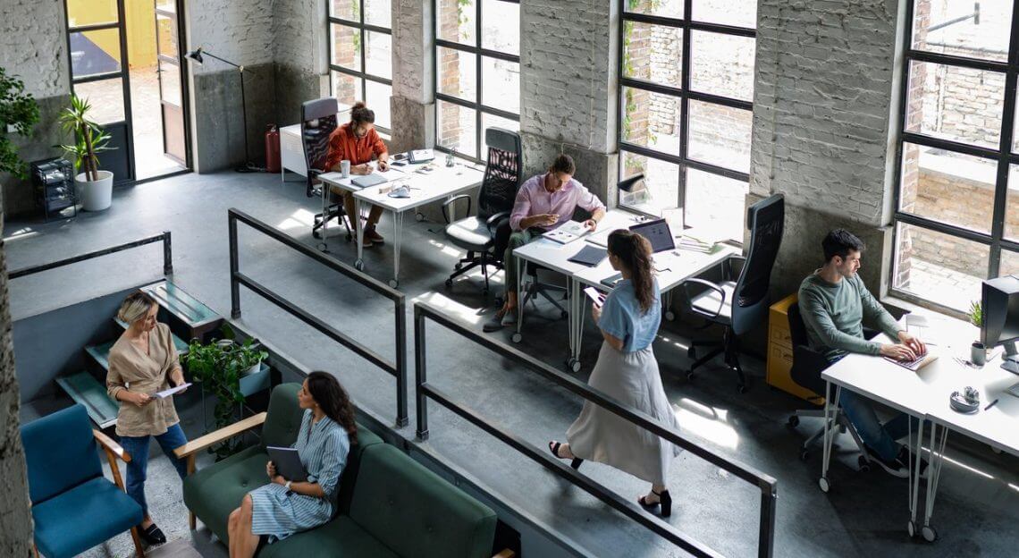 Young professionals collaborating in NYC loft office