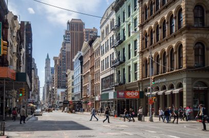 Broadway street scene in NYC, highlighting the quest for budget-friendly SoHo office spaces.
