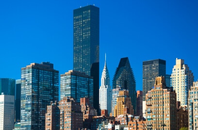 Manhattan skyline with Chrysler Building and Trump Tower, reflecting robust NYC office market.