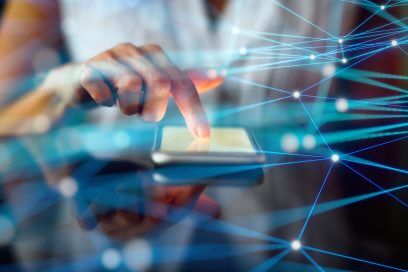 Engaging in NYC commercial real estate search with a smartphone, powered by PropTech innovations.