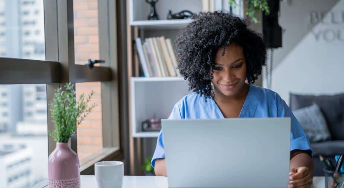 Nurse conducts a video call consultation in medical office space in Manhattan.