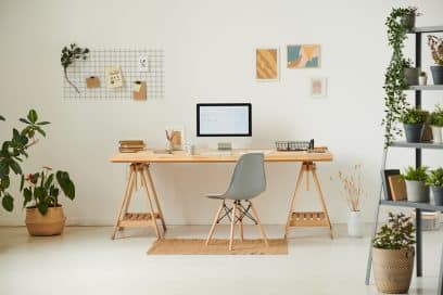 Comfortable workplace with potted plants.