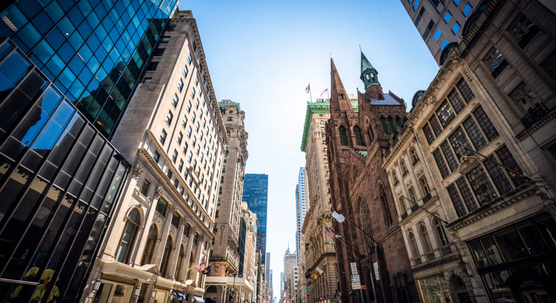 5th Avenue bustling with activity, reflecting NYC's commercial real estate landscape.