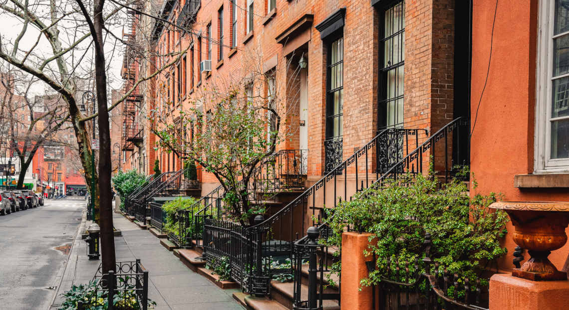 Iconic NYC buildings with fire escapes, ideal for media and publishing offices.