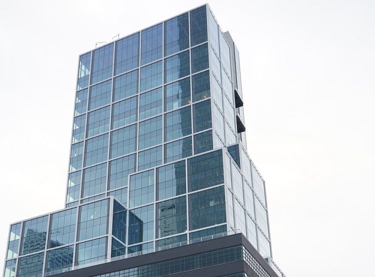 A mid-rise office tower located in the Hudson Yards submarket at 441 Ninth Avenue, New York City.