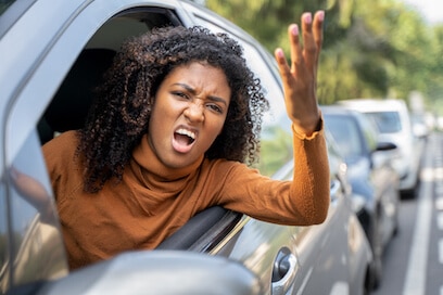 Aggressive car driver in NYC, illustrating traffic changes.