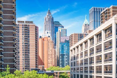 Sunny day in Lower Manhattan showcases potential commercial real estate investments amid market challenges.