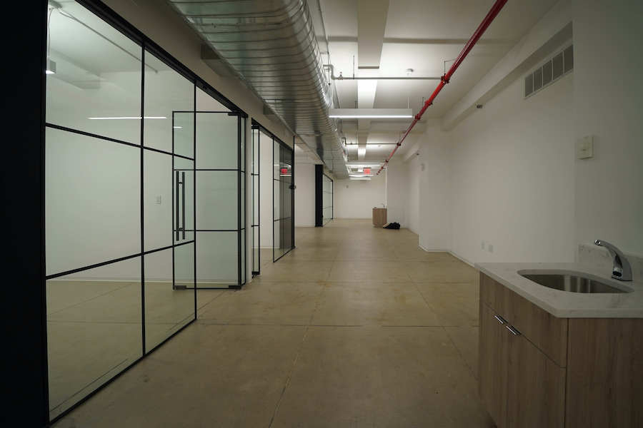 370 Lexington Avenue Office Space, 12th Floor - Hallway with Sink, Glass Offices on the Left