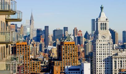 Sunny day in NYC, diverse skyline reflects challenges and hopes for commercial real estate.