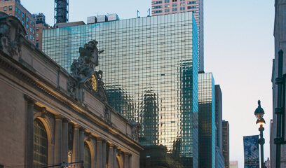 Dusk view of iconic NYC landmarks: Chrysler Building, Grand Central Terminal, and Grand Hyatt.