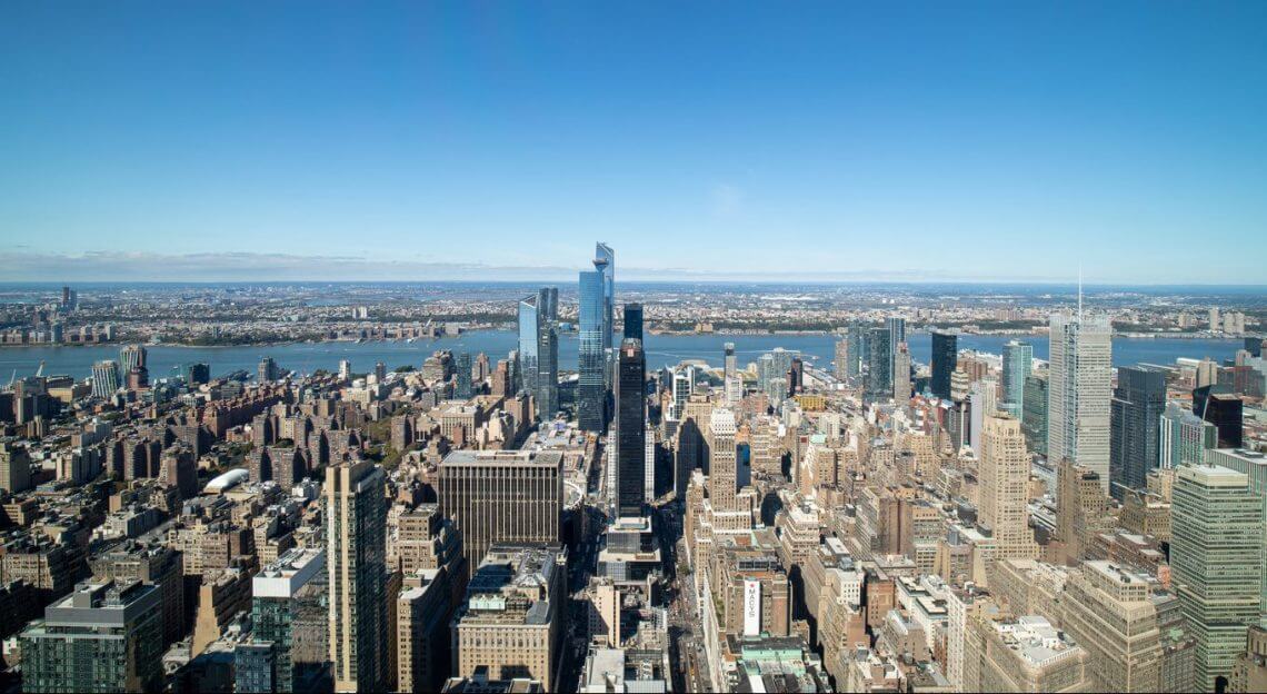 Aerial view of Midtown Manhattan, NYC, featuring 15 Penn Plaza in a tale of urban transformation.