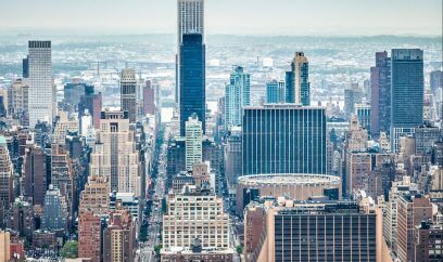 Aerial view Manhattan, with 15 Penn Plaza on the right, showcasing NYC's architectural ambition.