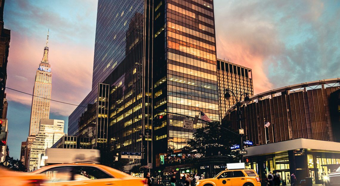 Yellow taxi near Penn Station, a commercial real estate hub facing transformation challenges.