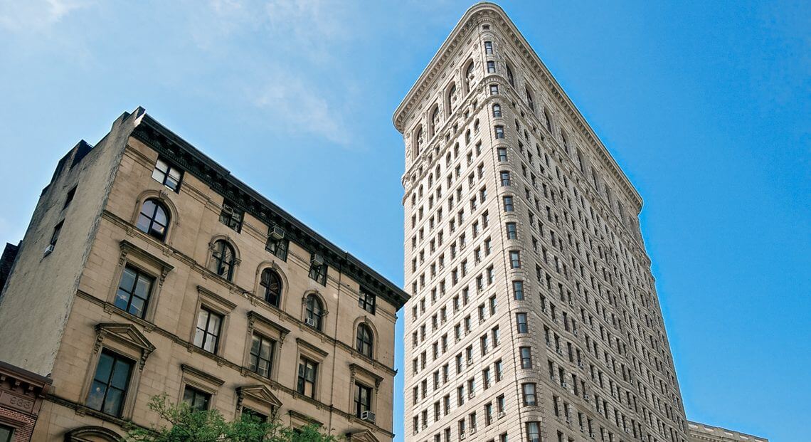 Flatiron Building skyline, with the left building hosting the revitalizing Harry Potter Store.