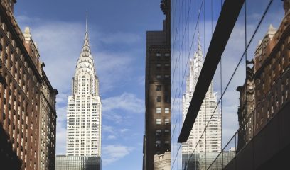 Reflective skyline of buildings in Manhattan, epitomizing NYC's commercial real estate landscape.