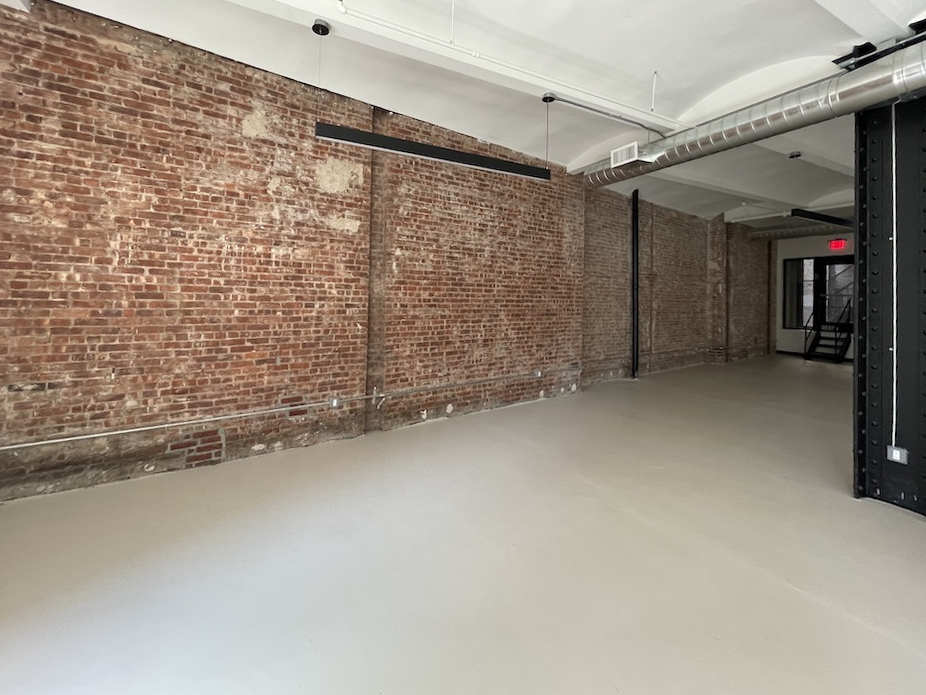 11 Broadway, 4th Floor Office Space - Red Brick Wall