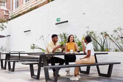Young businesspeople holding an outdoor office meeting