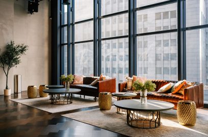 Lounge with sofa and city view; epitomizing modern law firm office spaces in NYC neighborhoods.