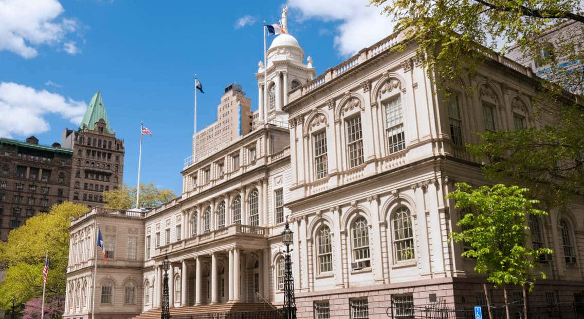 The entrance to City Hall in Manhattan, reflecting Mayor Adams' impact on NYC commercial real estate.