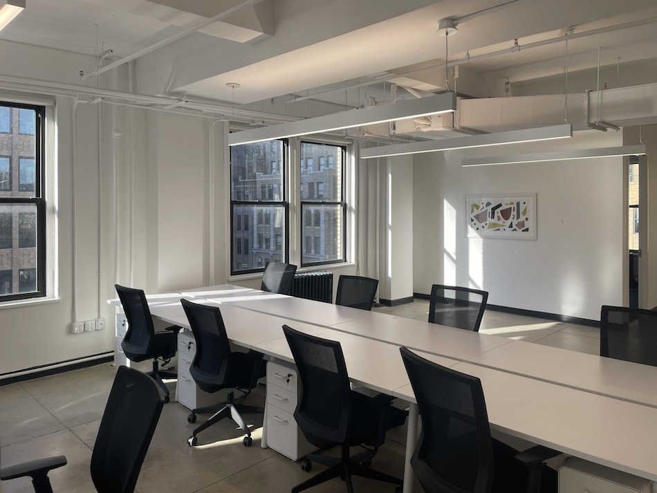 580 Eighth Avenue Office Space - a Row of Desks and Chairs