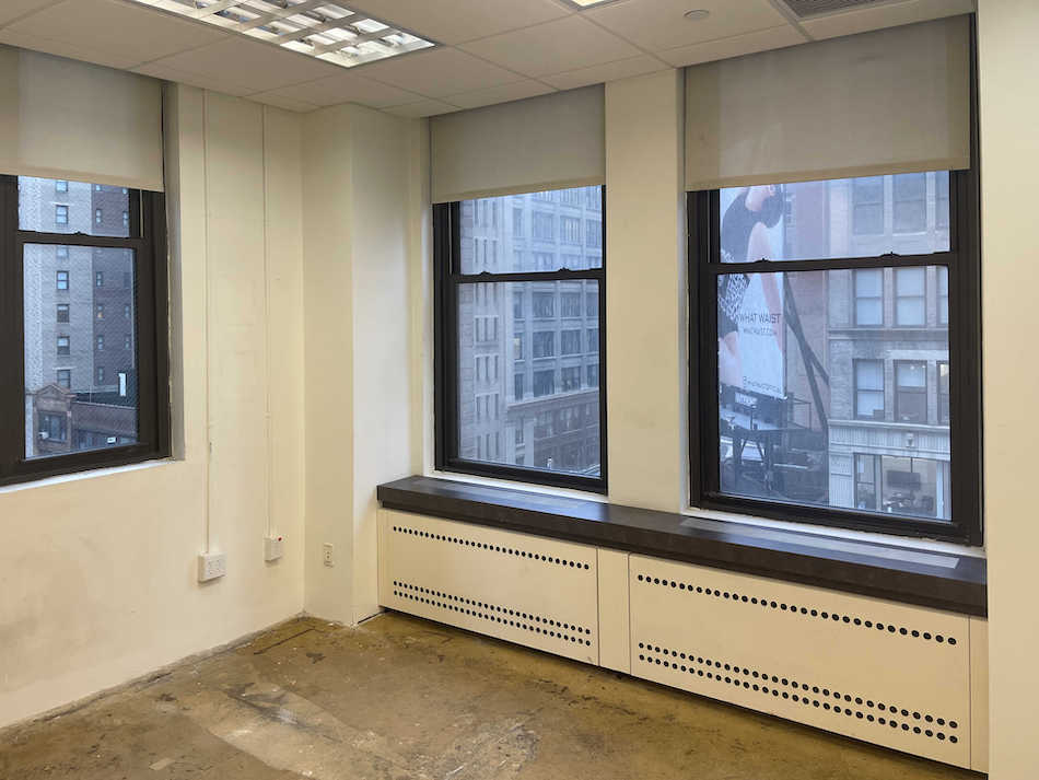 833 SF office space with two offices in a Class B building on Seventh Avenue near Penn Station.