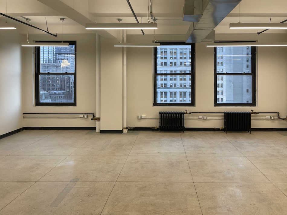 Bright office space for lease with Hudson River view on the 18th floor of 225 Broadway, NYC.
