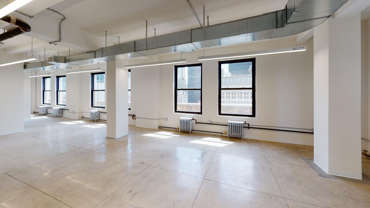 Bright corner office at 225 Broadway: 1,660 SF of open plan layout.