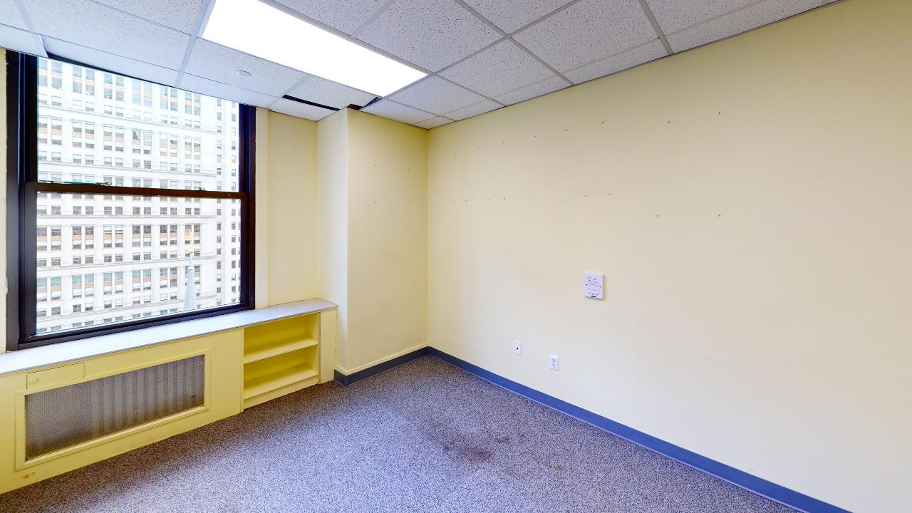 225 Broadway Office Space - Office Room with White Walls and Floor Carpet