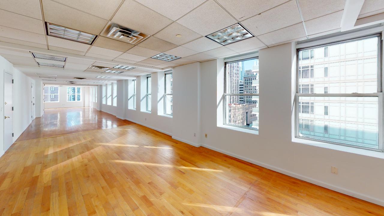 Bright commercial space at 315 Fifth Ave, with hardwood floors and Empire State Building Views.