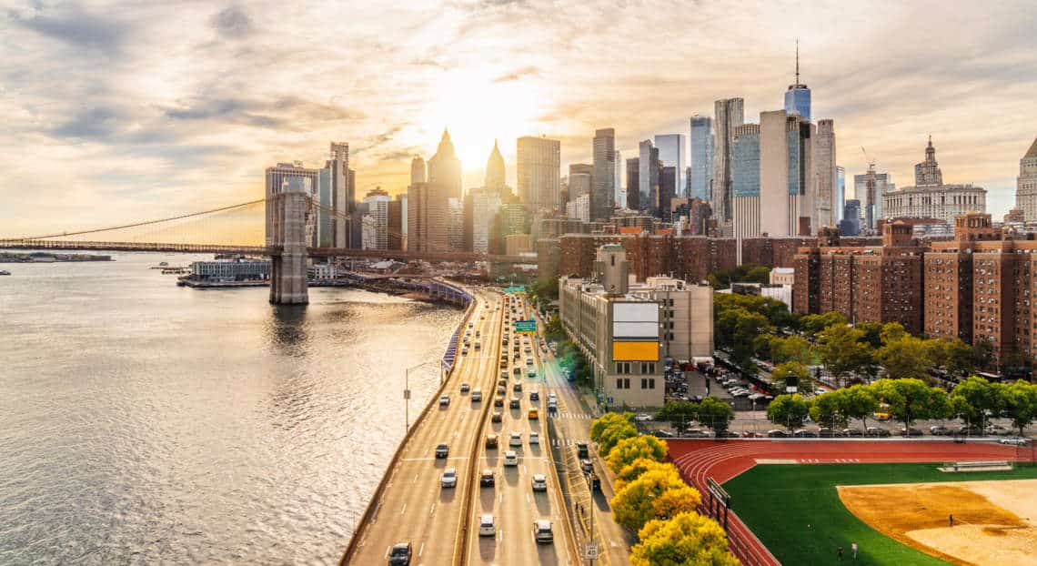 NYC at sunset from Manhattan Bridge, reflecting on the 2022 commercial real estate market.