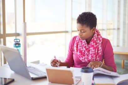 Young NYC Real Estate Student Studying Intently