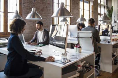 Young professionals in a NYC startup office.