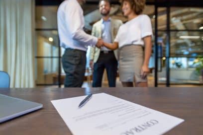 Business People Shaking Hands after Negotiating a Commercial Real Estate Lease.