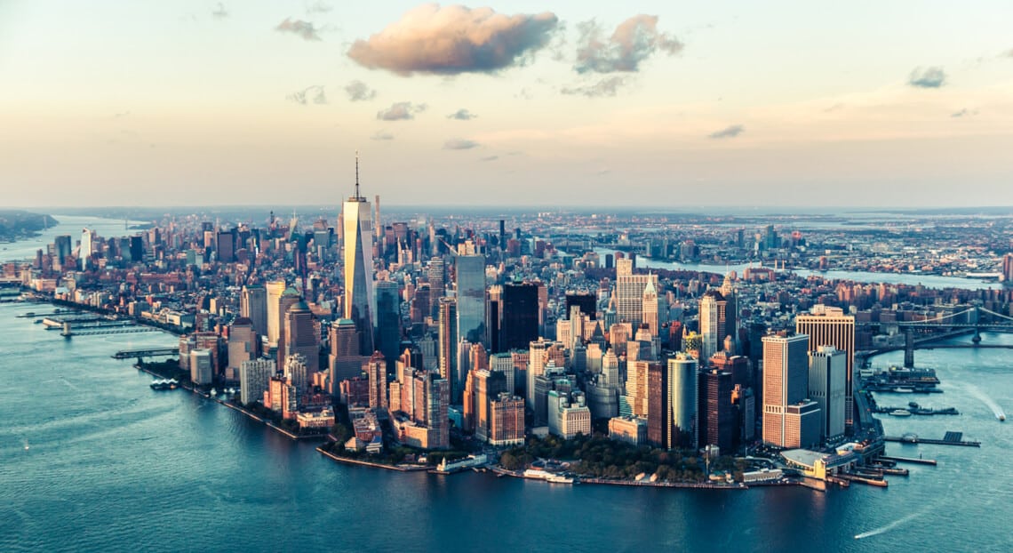 Manhattan Skyline at Sunset, Reflecting NYC's Uncertain Commercial Real Estate Future.