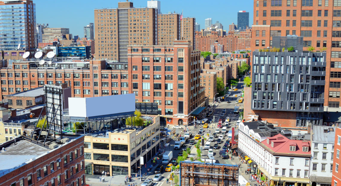 Chelsea intersection in Manhattan, highlighting the contrasting revival in NYC's neighborhoods.