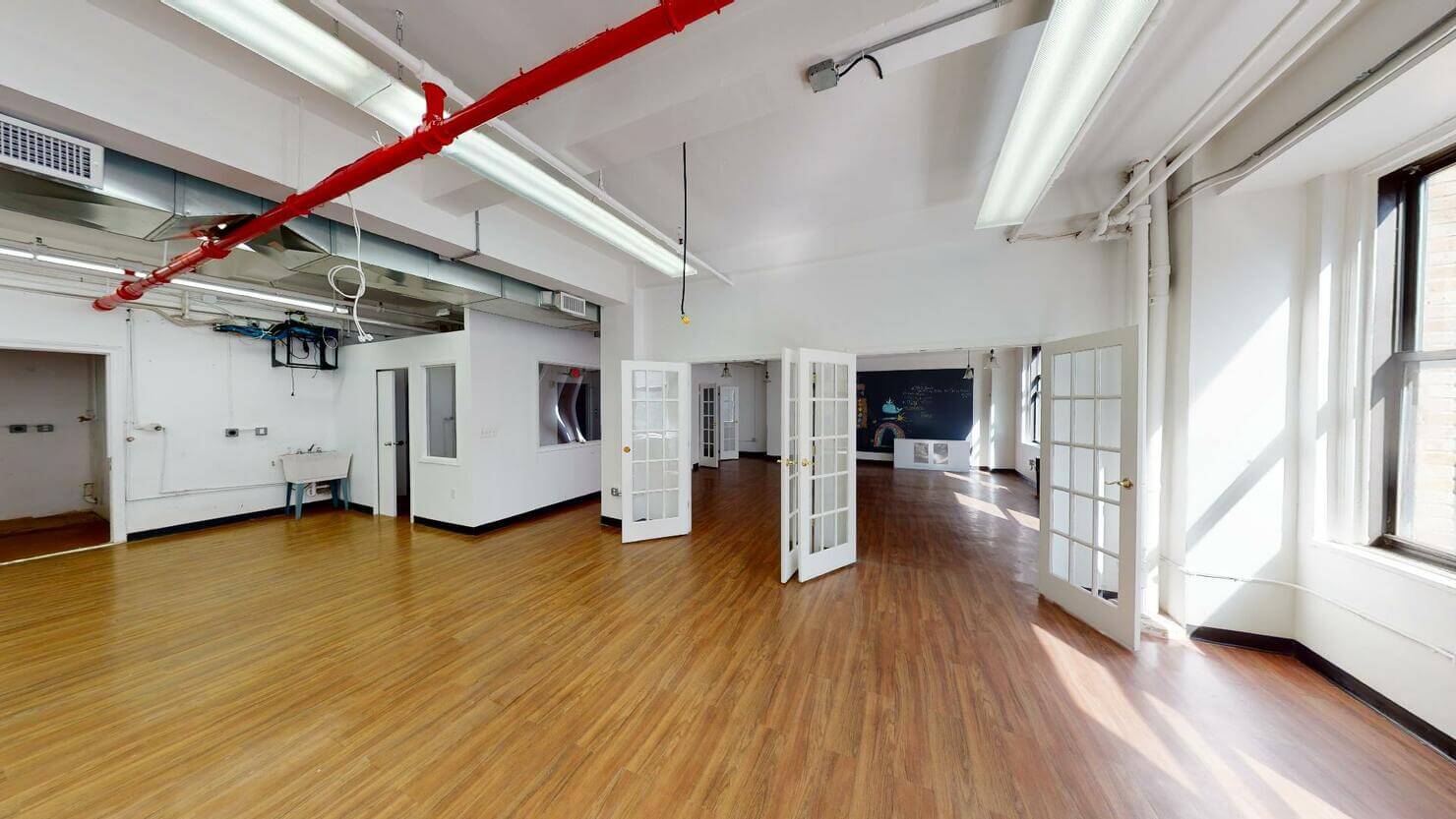 247 West 35th Street Office Space - multiple doors leading to the mid-size room.