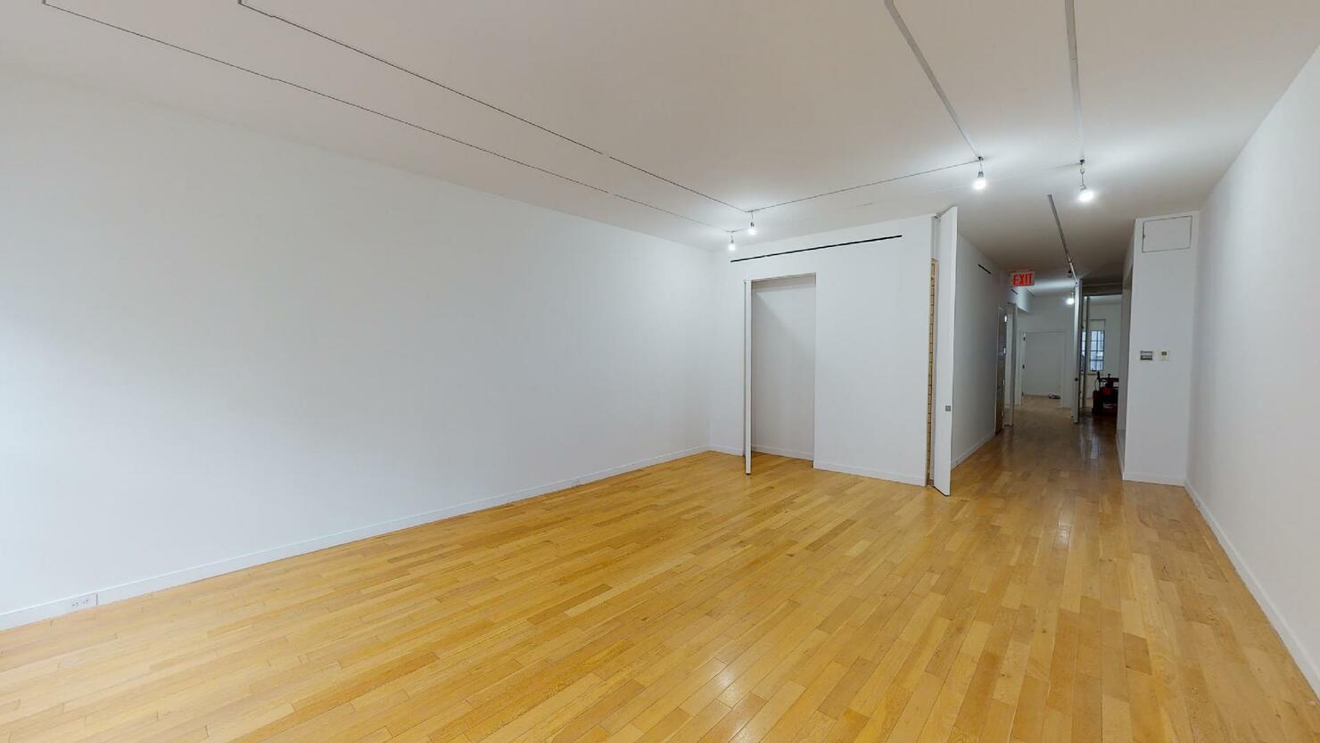 Renovated full-floor gallery space for lease on 23 East 67th Street, Upper East Side.