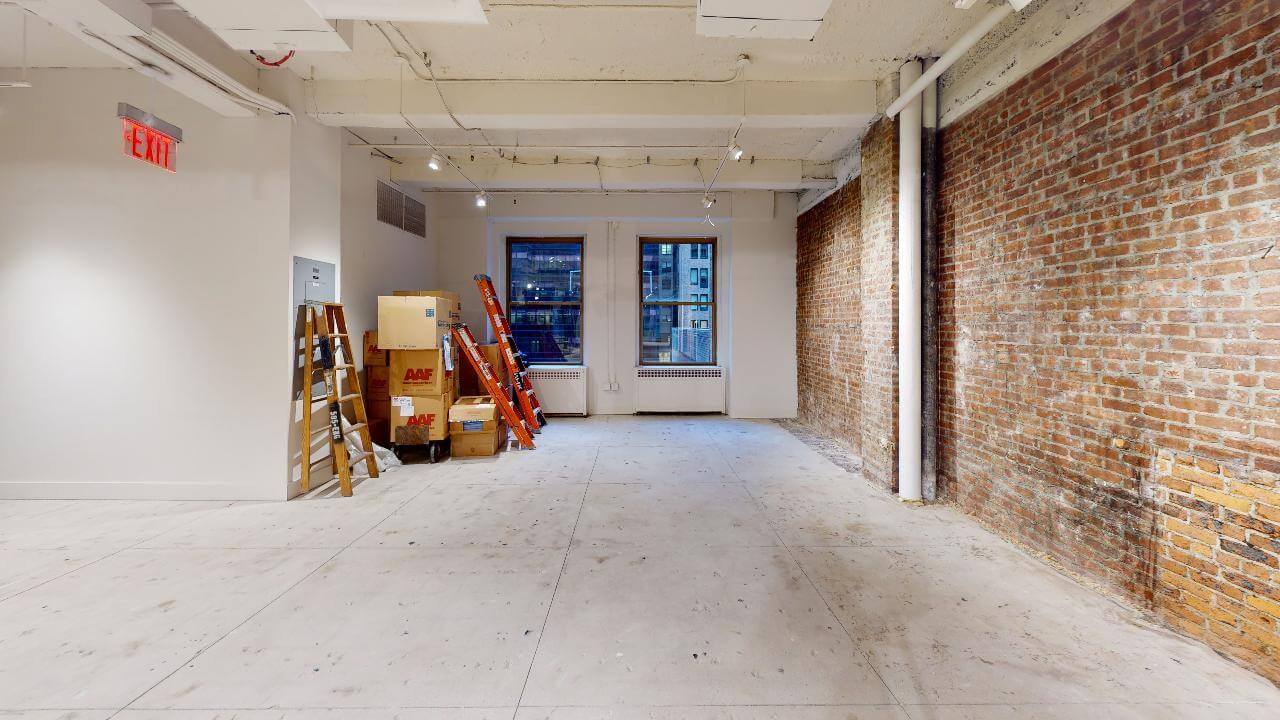 595 Madison Avenue Office Space, 5th Floor - Concrete Floor and Exposed Brick Walls