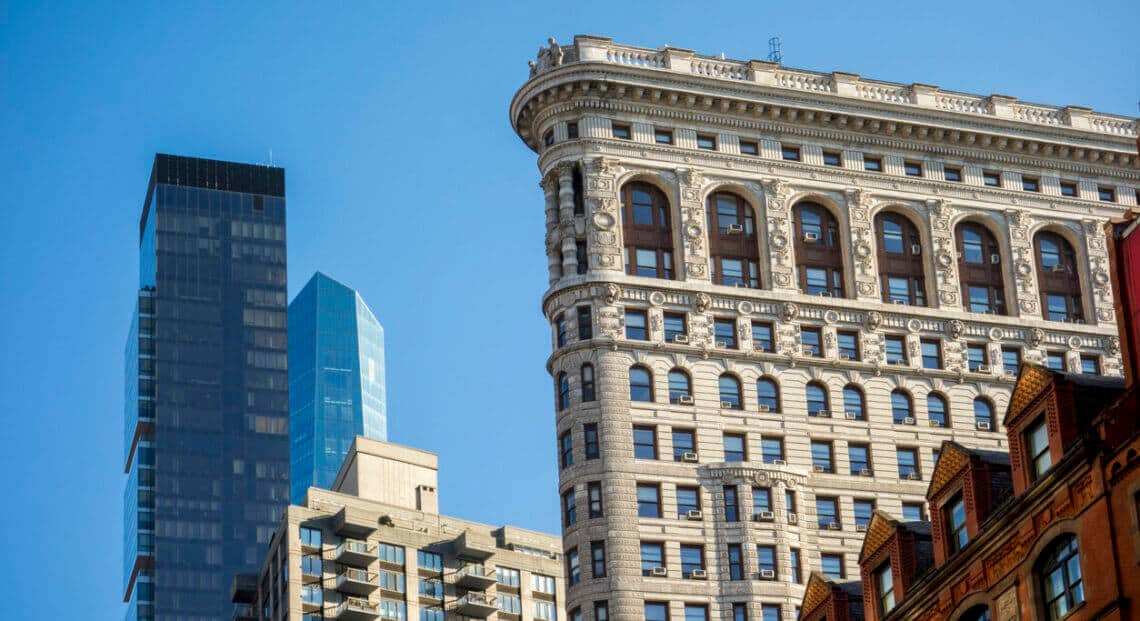 A wide-angle view of the Flatiron Building in New York City.