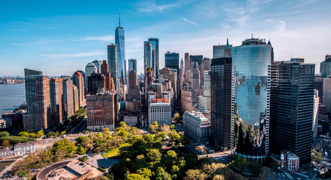 Aerial view of Battery Park at golden hour, showcasing prime office space at 32 Broadway.