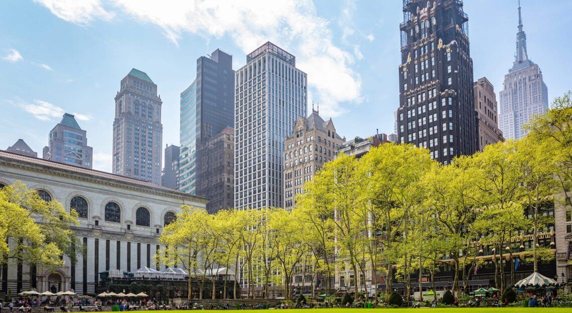 skyline view from Bryant Park in Midtown Manhattan, New York City in springtime.